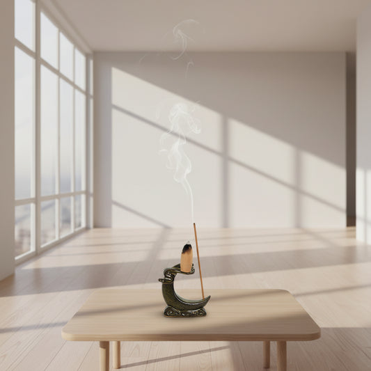 Incense burner with incense sticks on a woven mat