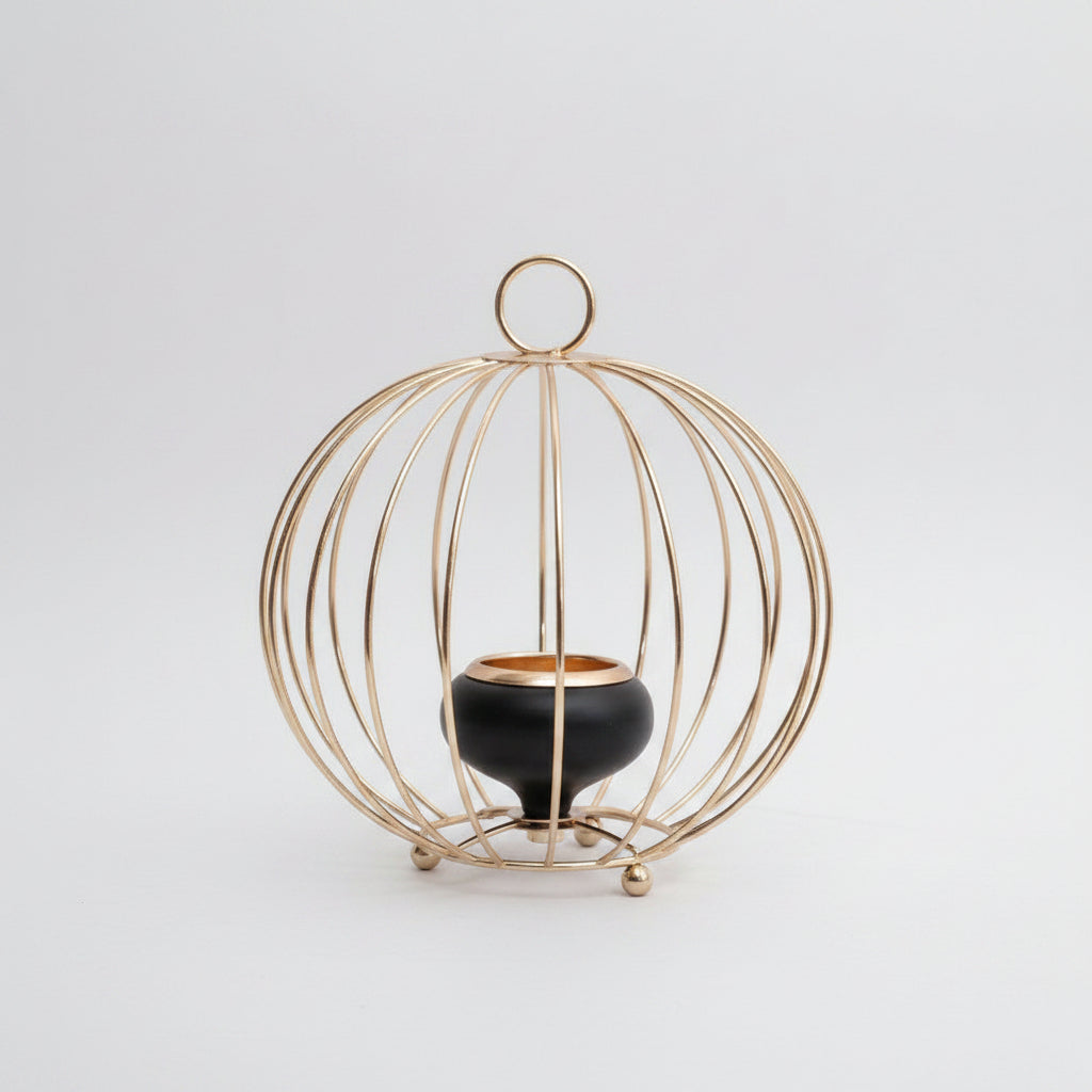 Decorative gold cage with a black pot inside, showing dimensions on a white background