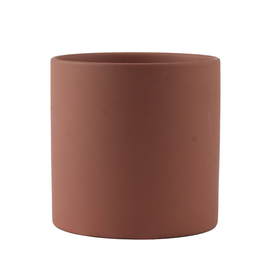 Brown cylindrical pot on a white background